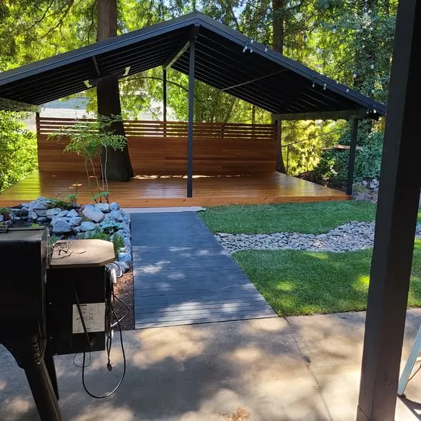 Finished covered pergola over a cedar deck with privacy screen