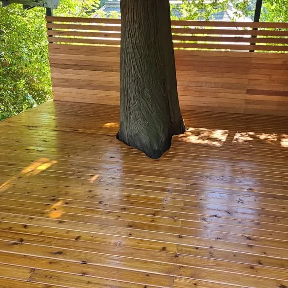 Cedar deck boards fitted around a mature tree