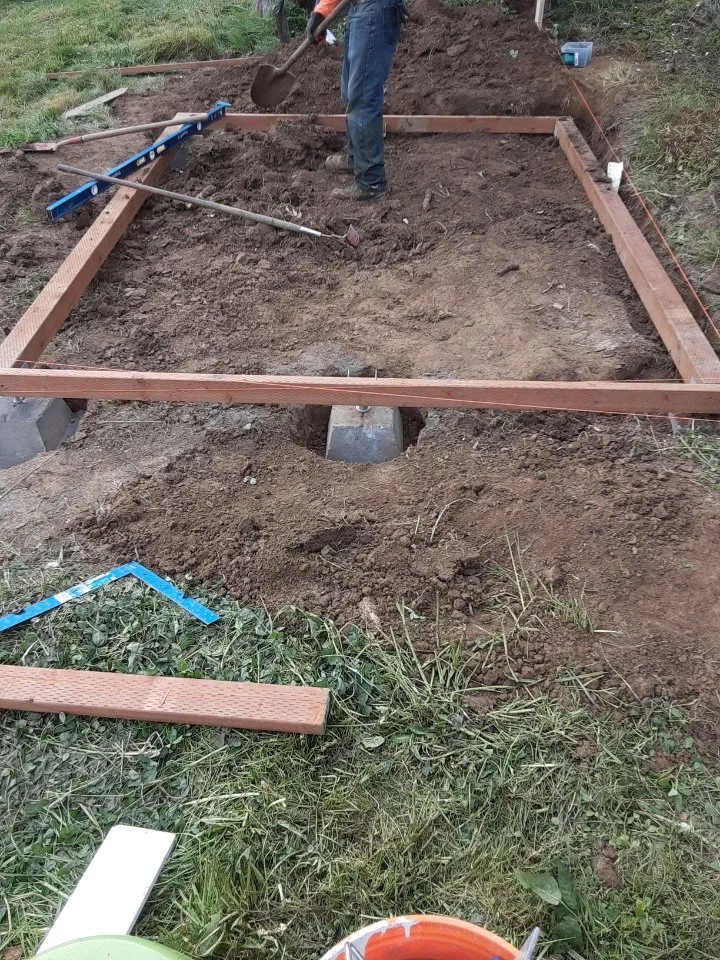 Shed floor frame laid out on gravel